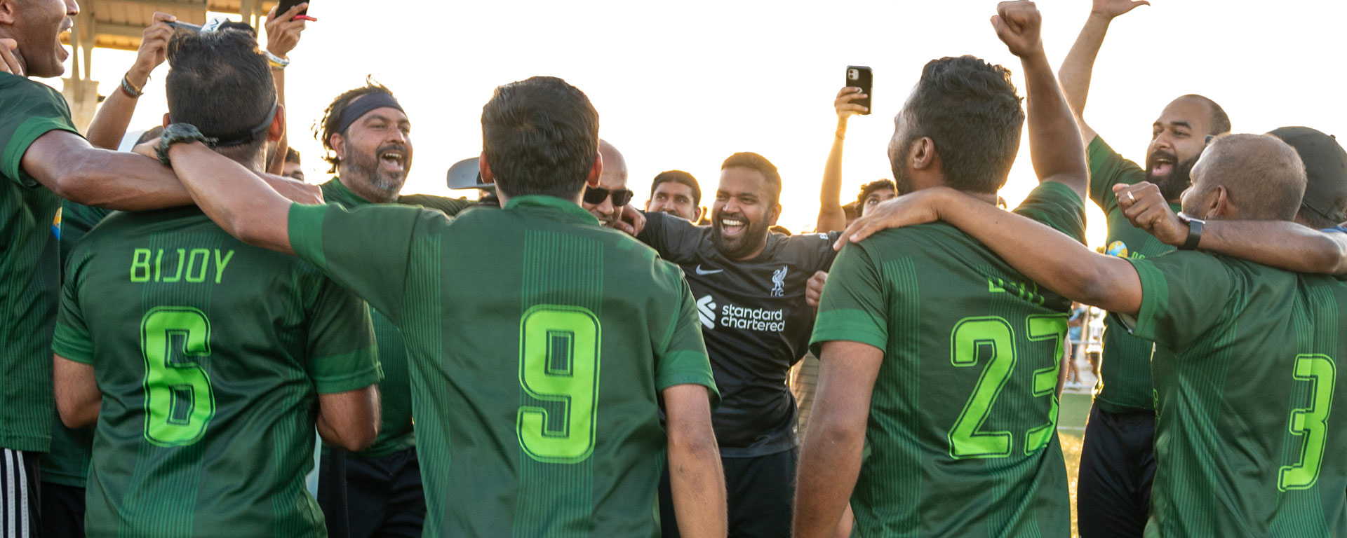 Celebrating a championship victory with the trophy.